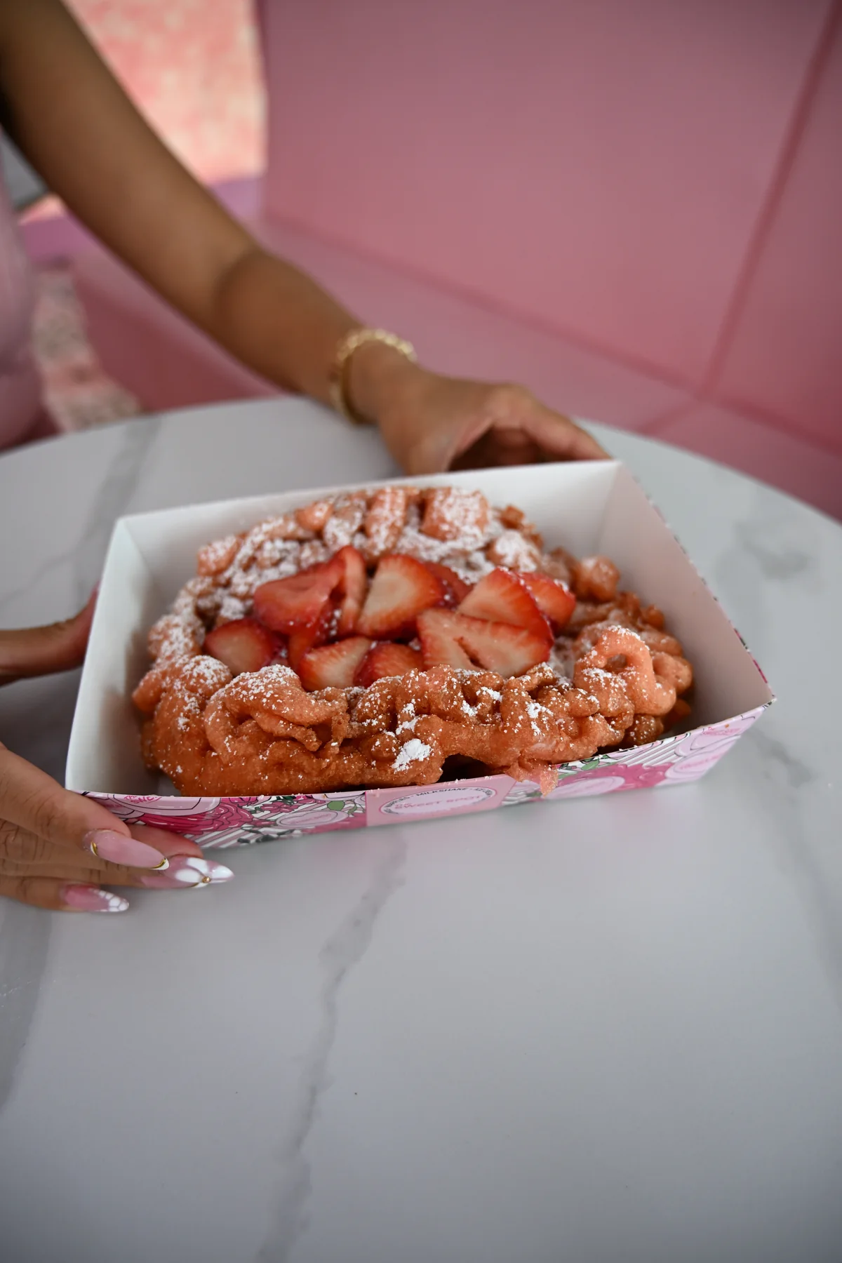 Strawberry funnel cake with powdered sugar from The Sweet Spot in Virginia Beach