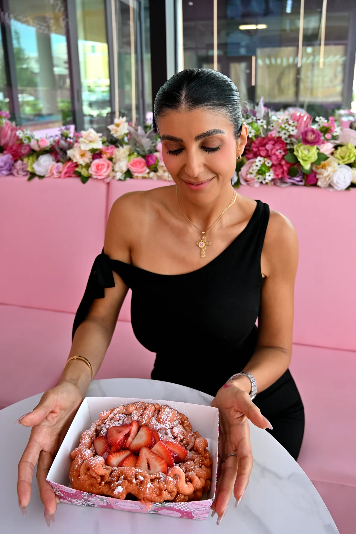 Strawberry funnel cake with powdered sugar from The Sweet Spot in Virginia Beach