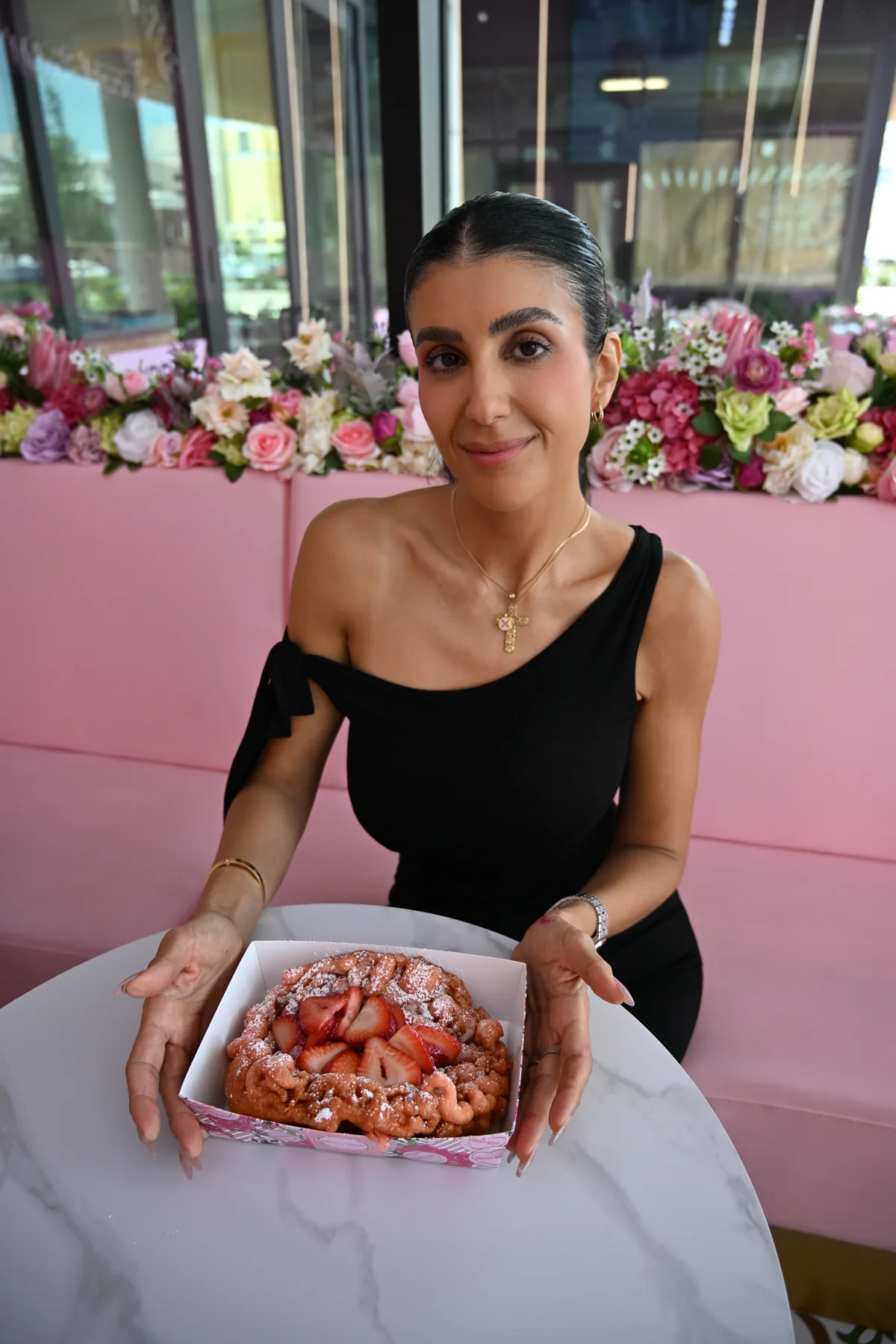Strawberry funnel cake with powdered sugar from The Sweet Spot in Virginia Beach
